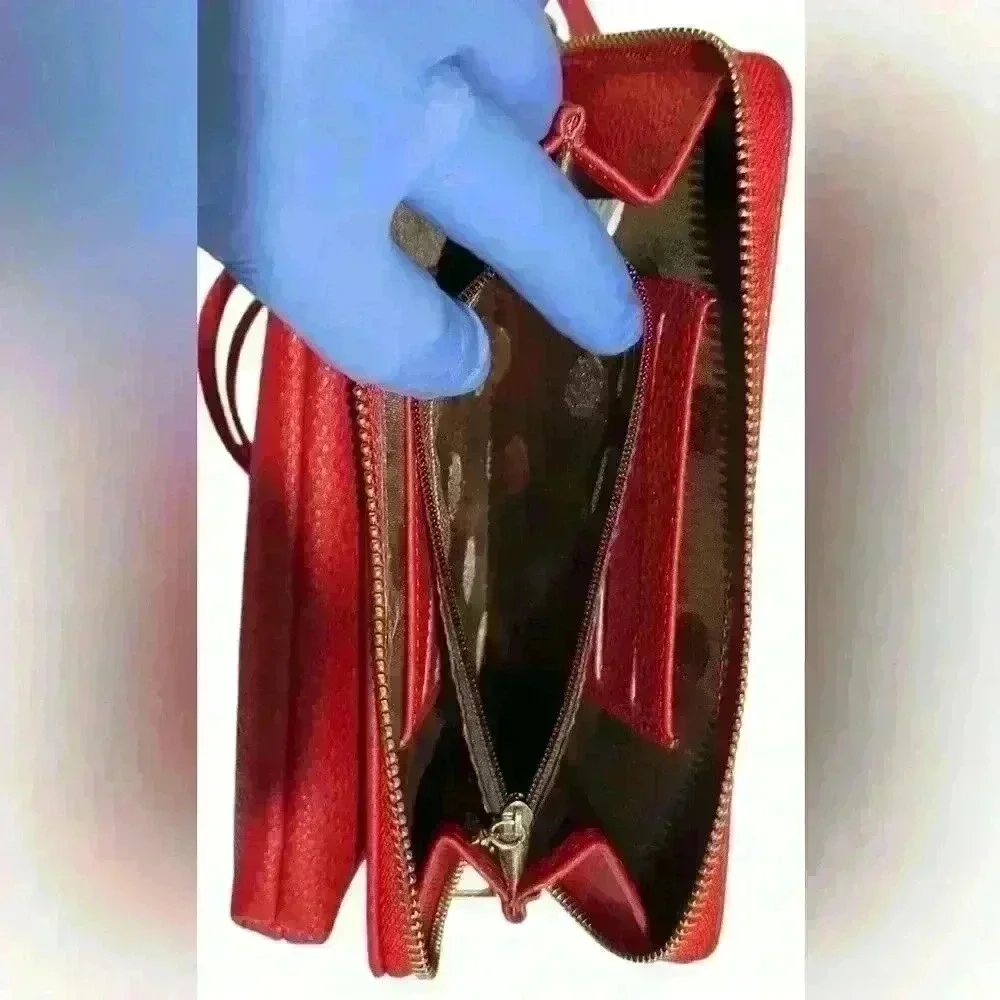 A Forever Young red woman’s,Crossbody bag / wallet with attached iPhone carrier.